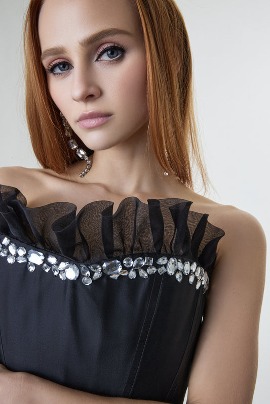 Elegant black dress with structured silhouette